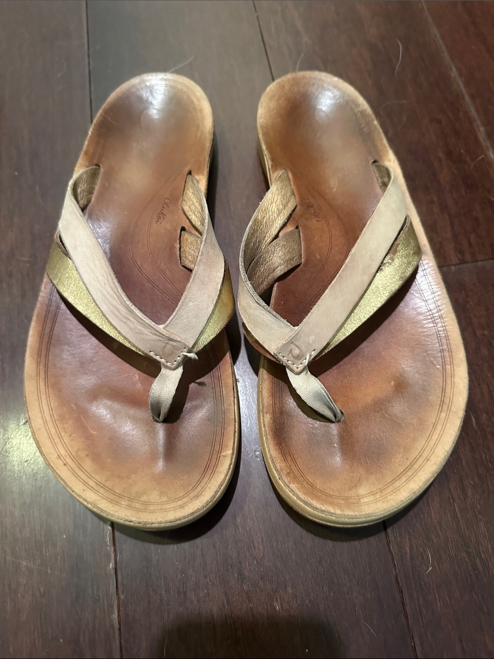 OluKai Women's Tan and Gold Leather Flip Sandals